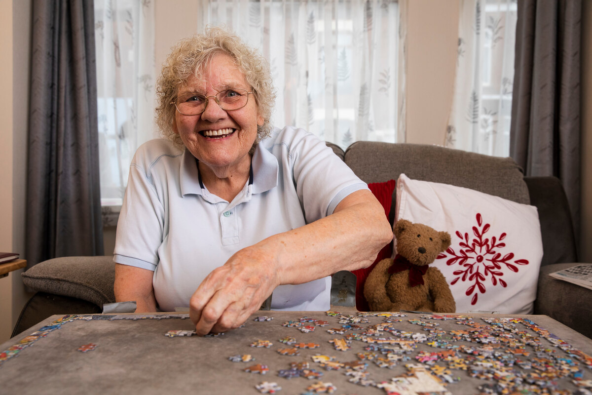 Senior woman engaged in dignified daily routine and personalized care at home