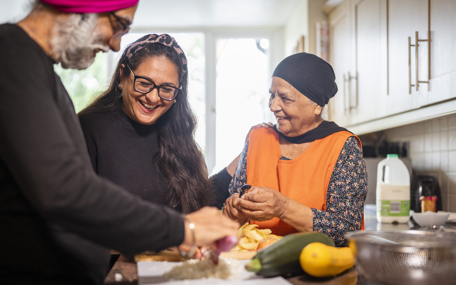 Elderly gentleman smiling warmly while receiving companion care and home assistance